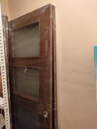 Puerta doble corredera con cristales 