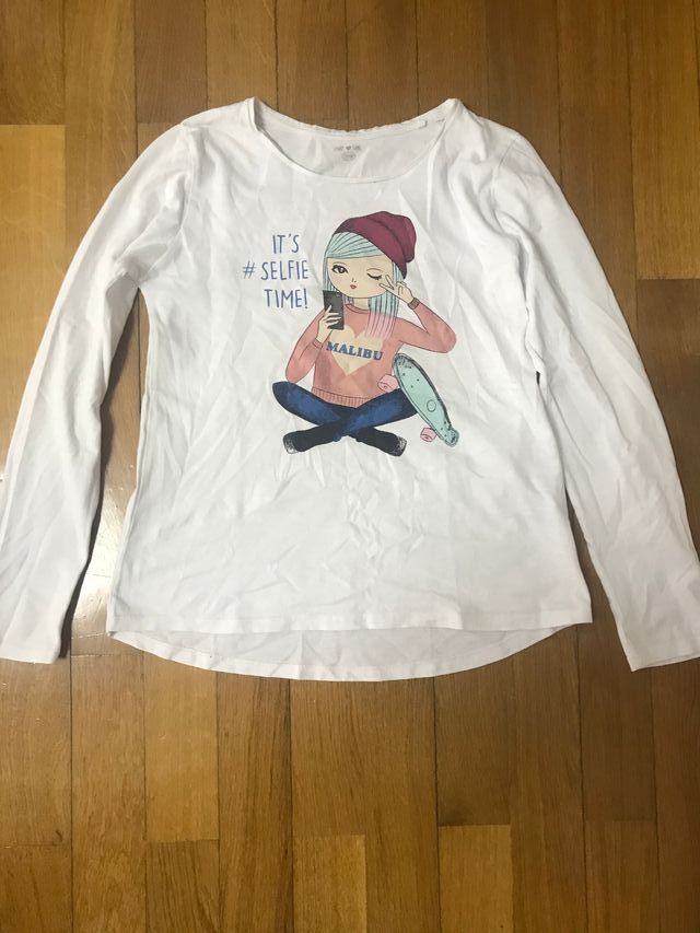 Camiseta blanca dibujo niña sentada talla 13-14 añ