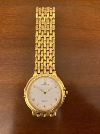 Reloj de pulsera chapado oro l’etoile.