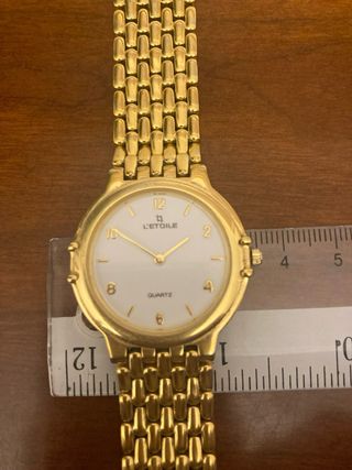 Reloj de pulsera chapado oro l’etoile.