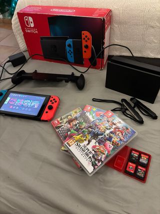 Nintendo switc con varios juegos y fundas
