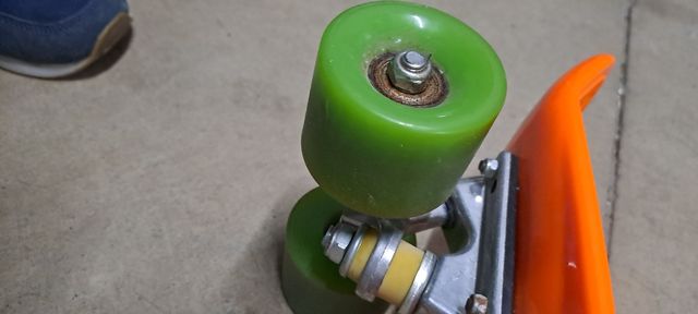 Monopatín peny naranja