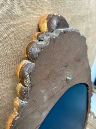 Elegante espejo tallado en madera y dorado en oro