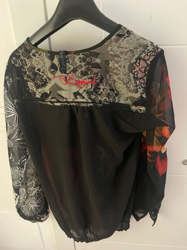 Blusa desigual talla M