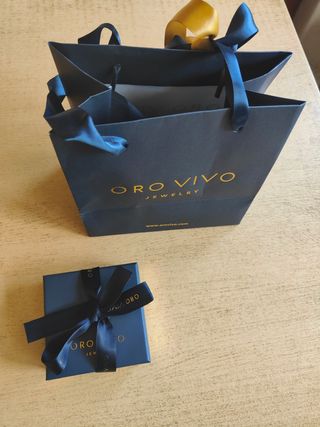 Caja y bolsa oro vivo