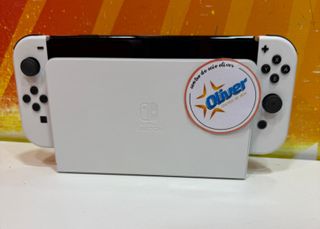 Nintendo switch oled blanca + cargador SEMINUEVA