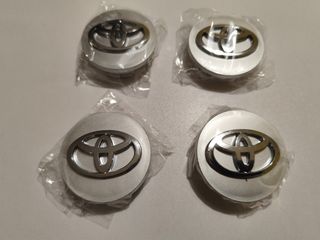 Tapabujes Toyota Corolla 57mm nuevos