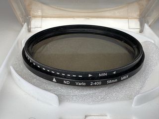 Canon EF 85mmf 1.8  + parasol original +(2filtros)