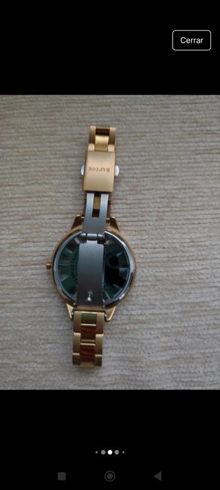 Reloj dorado Raptor número romanos y esfera blanca