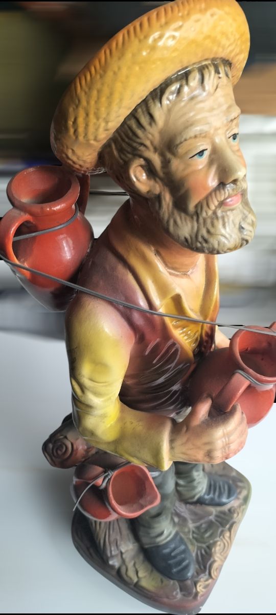 Jarrón anciano vendedor cantaros  ceramica