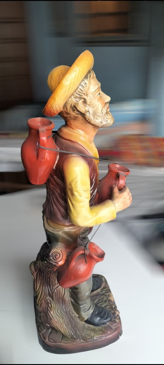 Jarrón anciano vendedor cantaros  ceramica