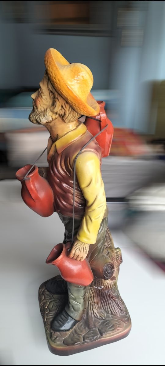 Jarrón anciano vendedor cantaros  ceramica