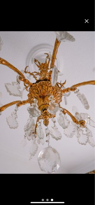 Lámpara de araña bronce super antigua.