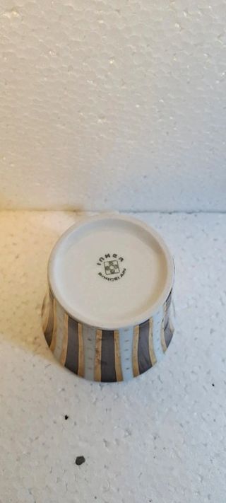 Coppia tazze e piattini in porcellana Inker