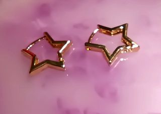 Pendientes aro de estrella acero inox.