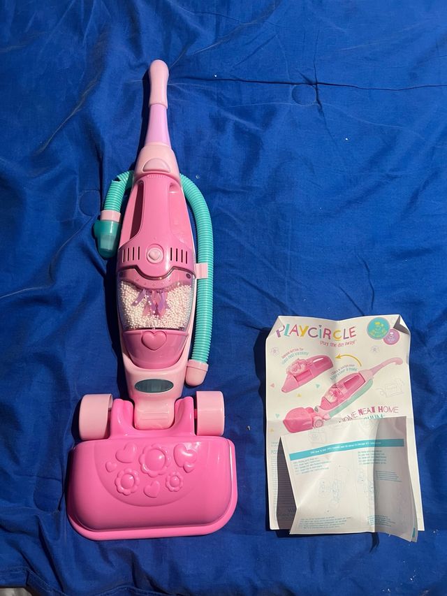 Aspirador de brinquedo.