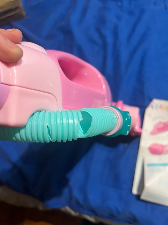 Aspirador de brinquedo.