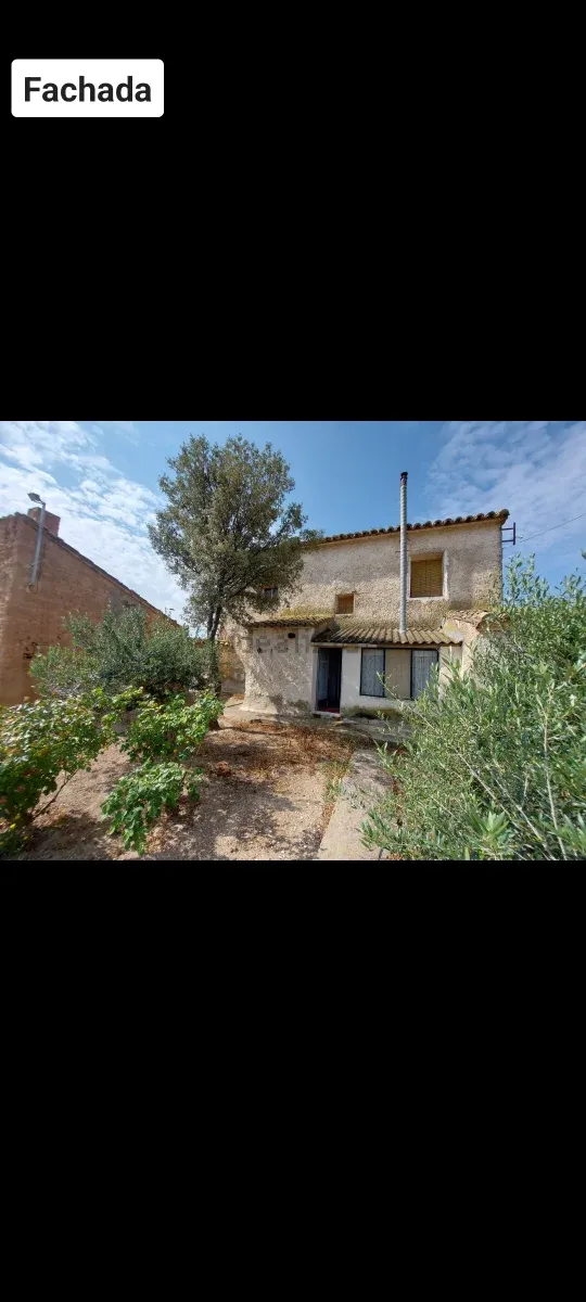 Terreno con casa de pueblo