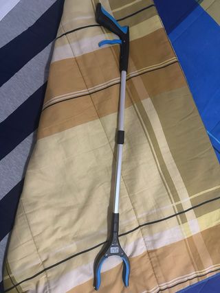 Pinza recogedora plegable