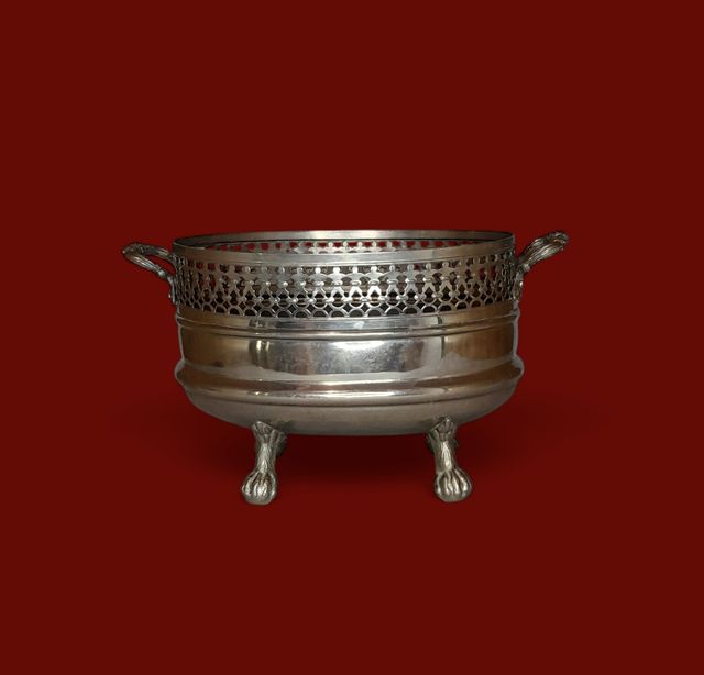 Centro de mesa de laton cromado.