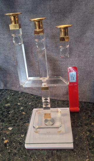 OROLOGIO E PORTACANDELE IN METRAKILATO.