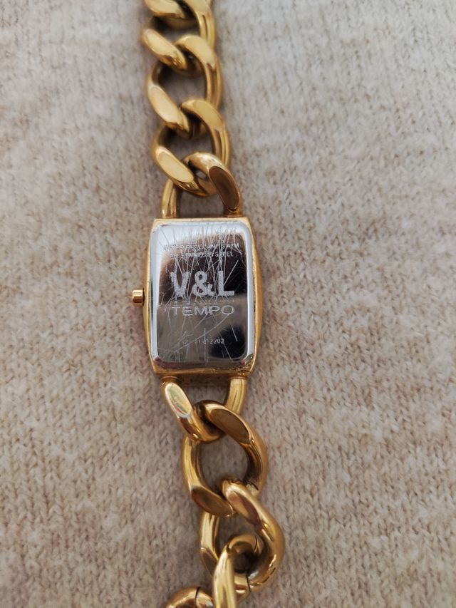 Reloj dorado victorio y luchino