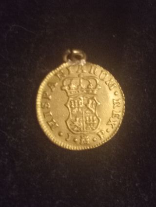 Antigua moneda de oro Carlos III