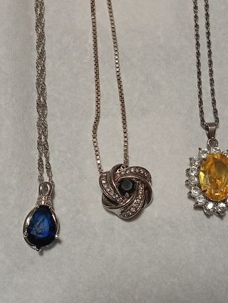 Lotto di 9 collane con pendenti argento