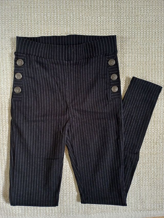 Pantalón y bolso mano