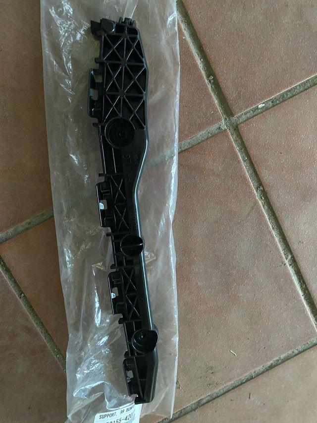 Soporte lateral amortiguador