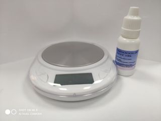 Balanza y agua de toque 18k