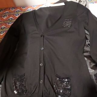 Jersey con bolsillos con lentejuelas