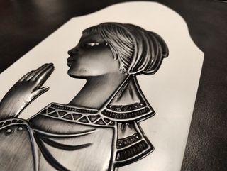 Madonna in preghiera in metallo a sbalzo anni 50