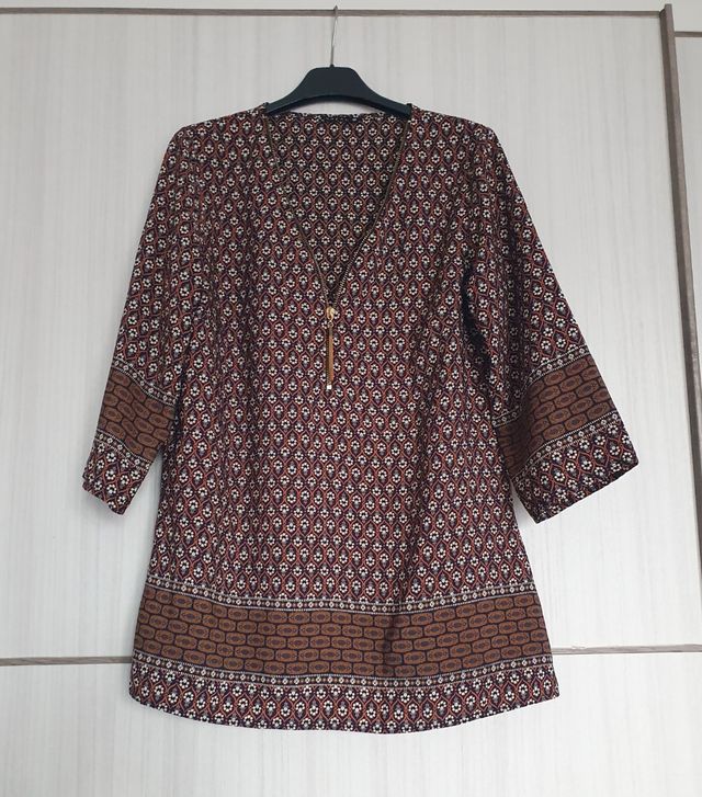 Bluse a fantasia con cerniera dorata