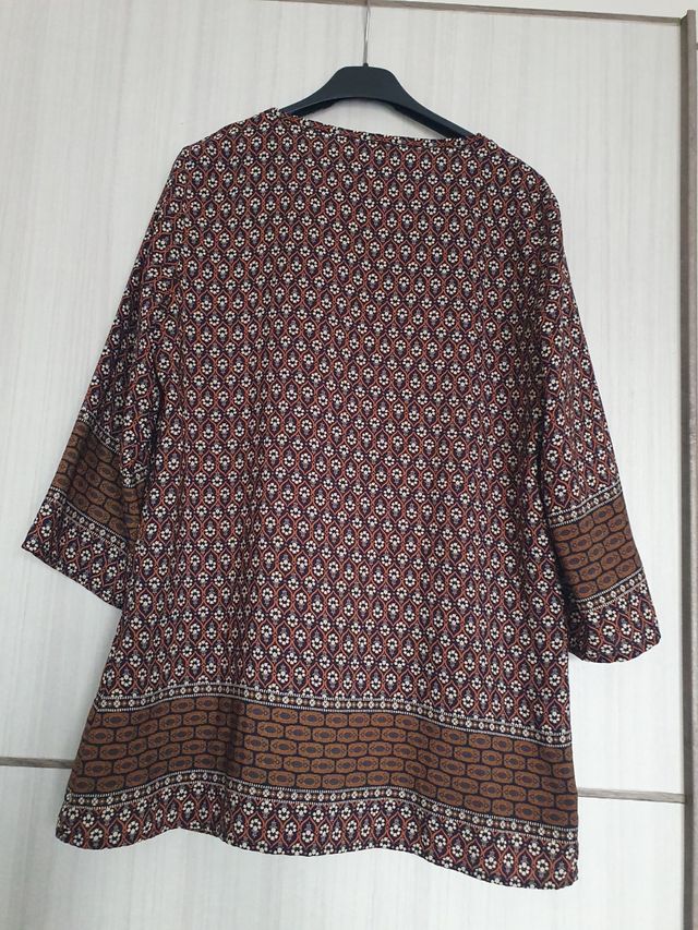 Bluse a fantasia con cerniera dorata