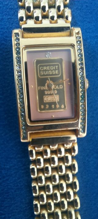 Reloj dorado con plaquita de oro