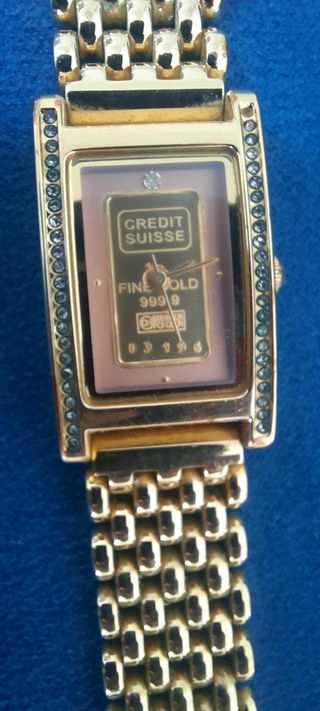 Reloj dorado con plaquita de oro