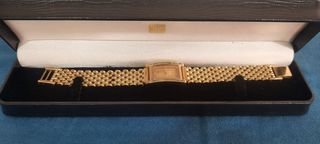 Reloj dorado con plaquita de oro