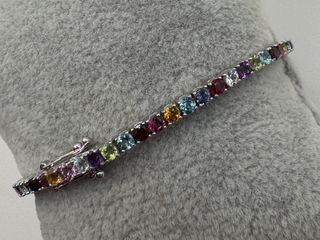 Pulsera riviere de 18 kt con gemas naturales