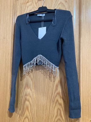 Top corto / jersey con brillos Zara
