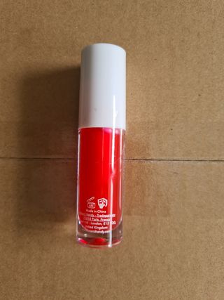 Brillo de labios con color Merci Handy