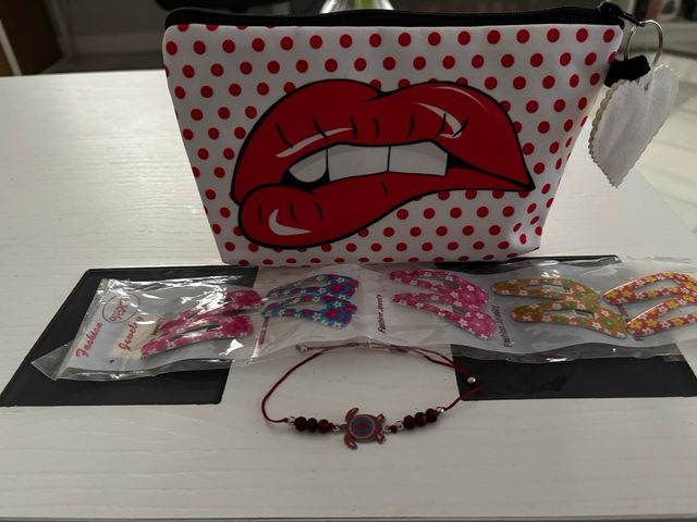 Lote neceser orquillas pulsera