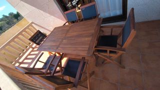 Conjunto Mesa teca extensible terraza  y 6 sillas.