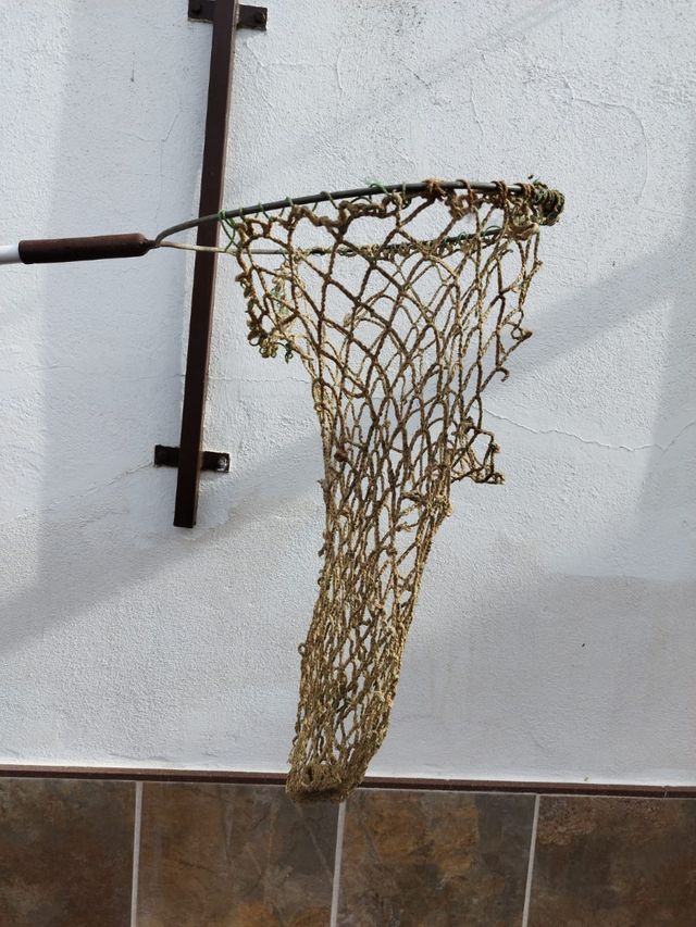 Recogedor de peces de cuerda muy antiguo