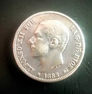 moneda plata de dos pts, estrella visible