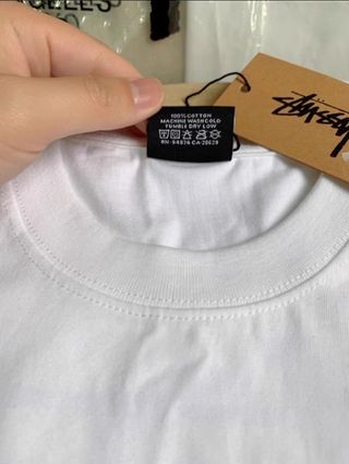Stussy manga corta
