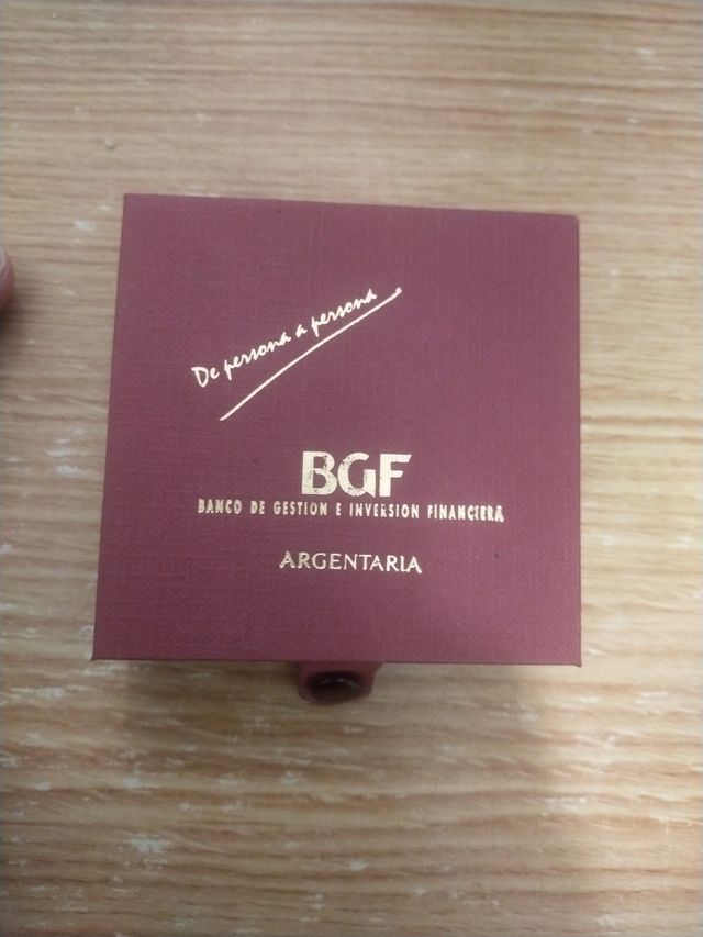 Moneda promocional plata y oro