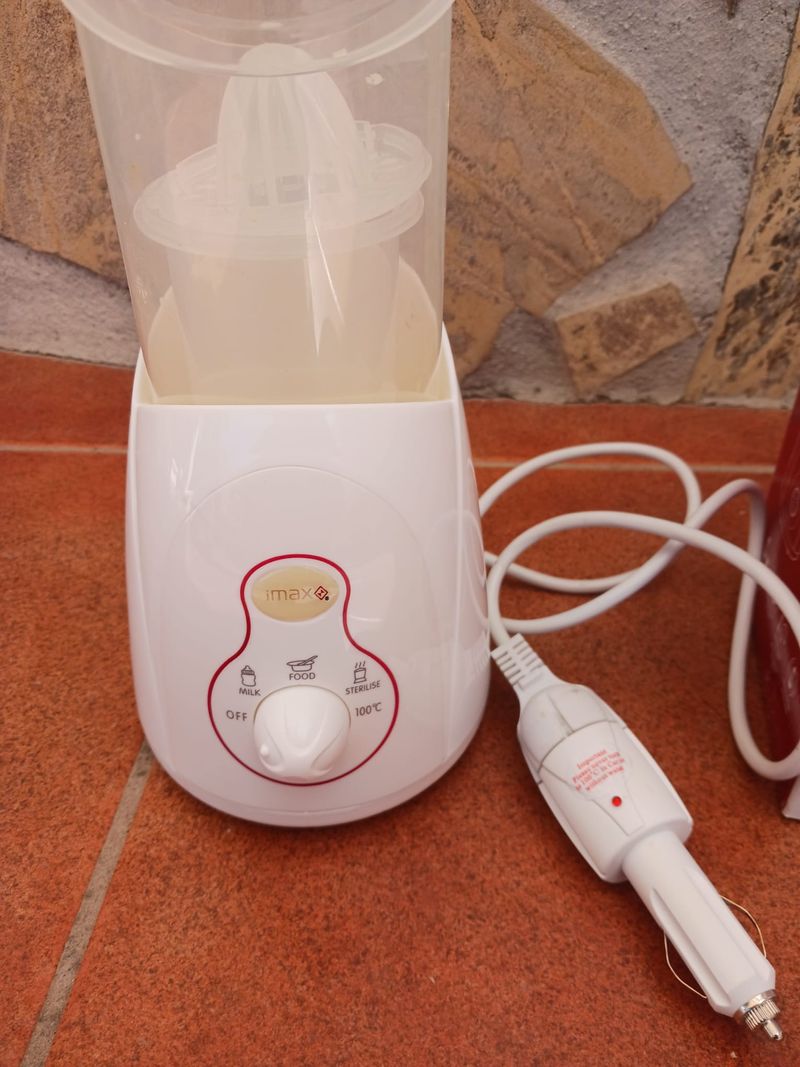 CALIENTA BIBERONES PORTATIL PARA COCHE ELECTRICO de segunda mano