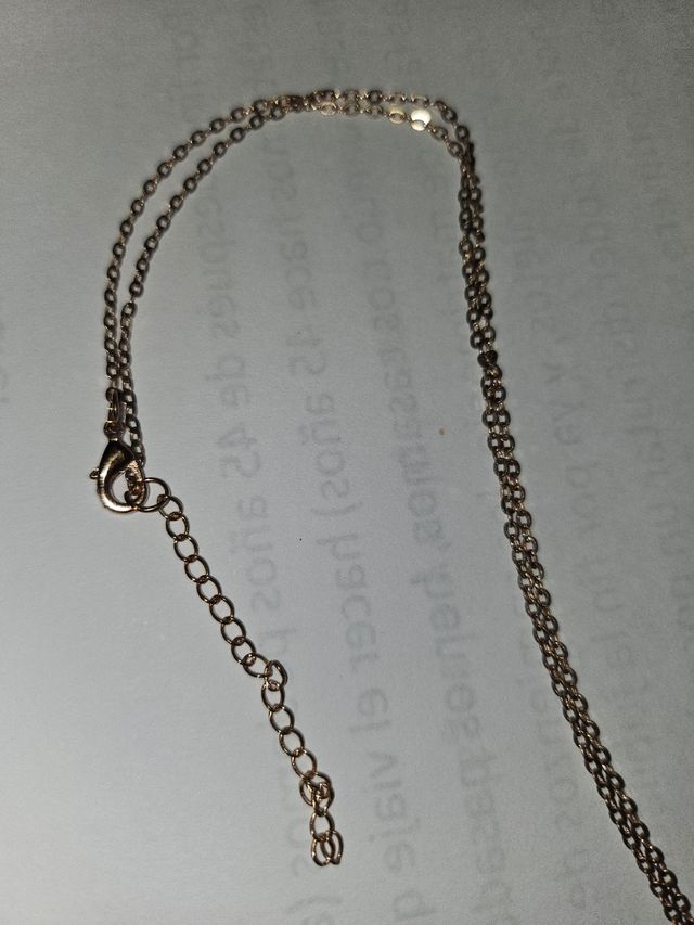 Cruz en oro rosa con circonitas