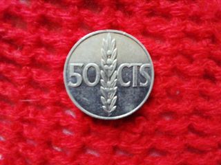 Monedas de 10 cts, 50 cts (dos) y de 1 peseta. 